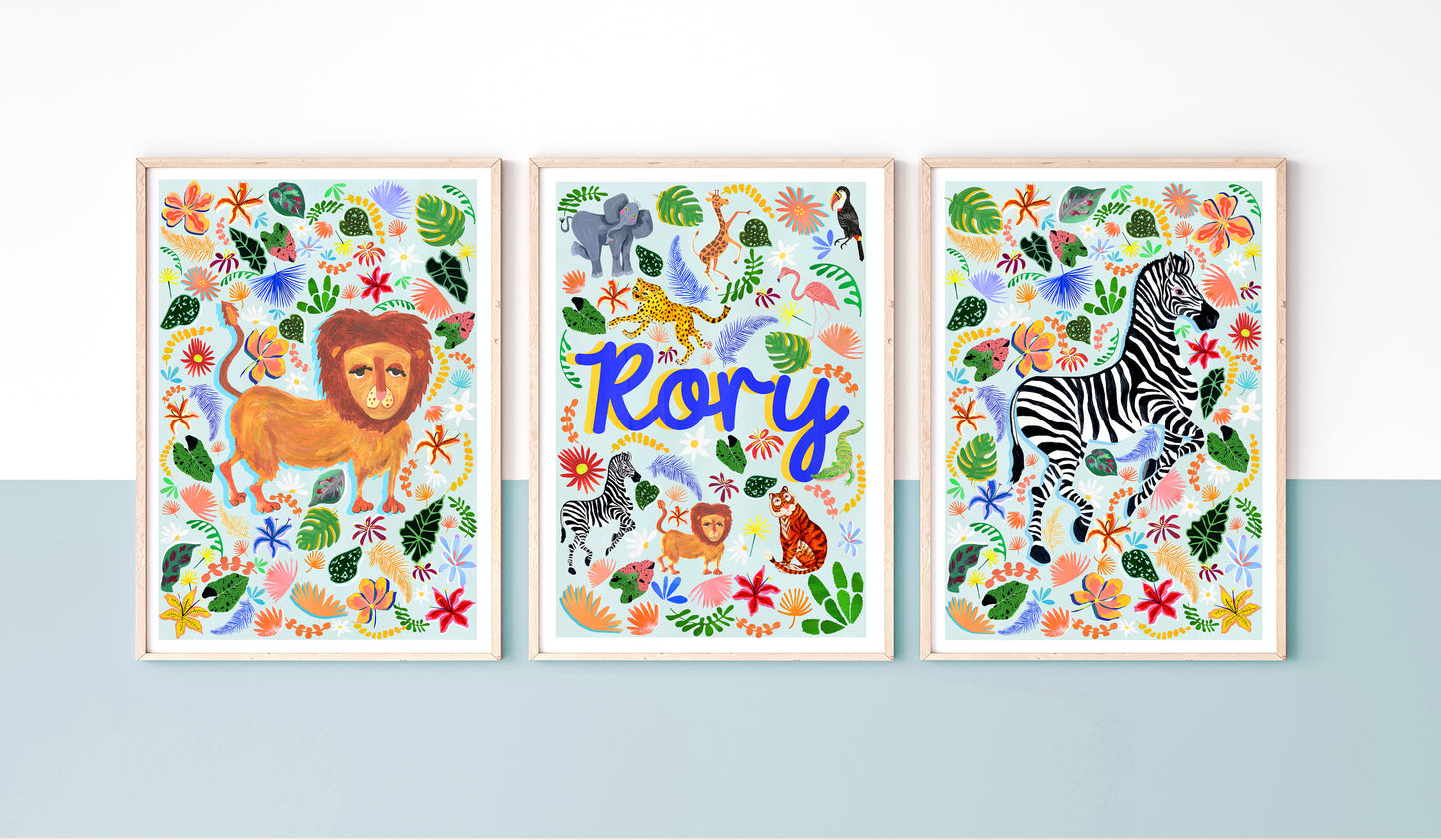 Three colorful animal-themed prints with a lion, zebra, and text on a blue background