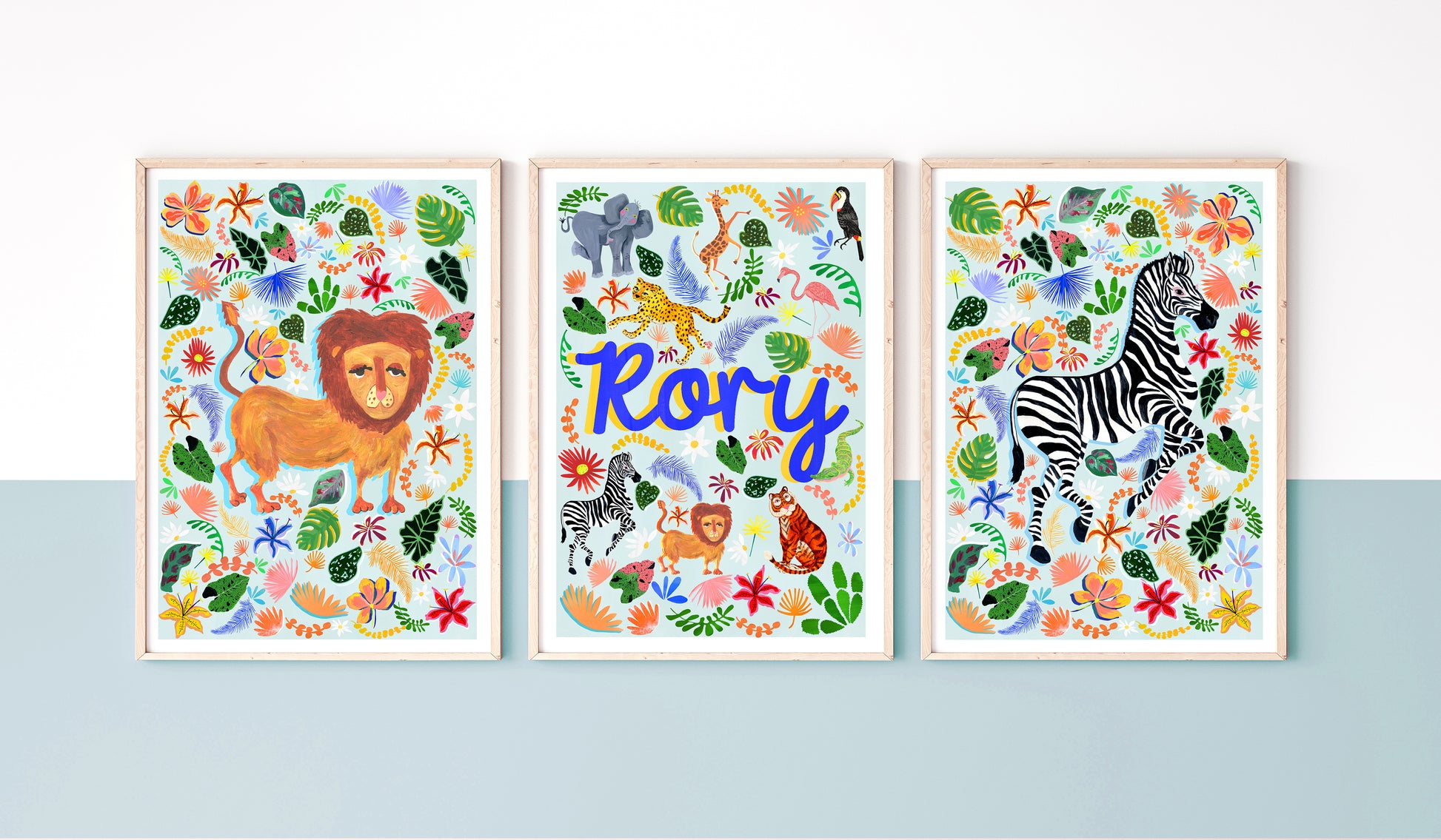 Three colorful animal-themed prints with a lion, zebra, and text on a blue background