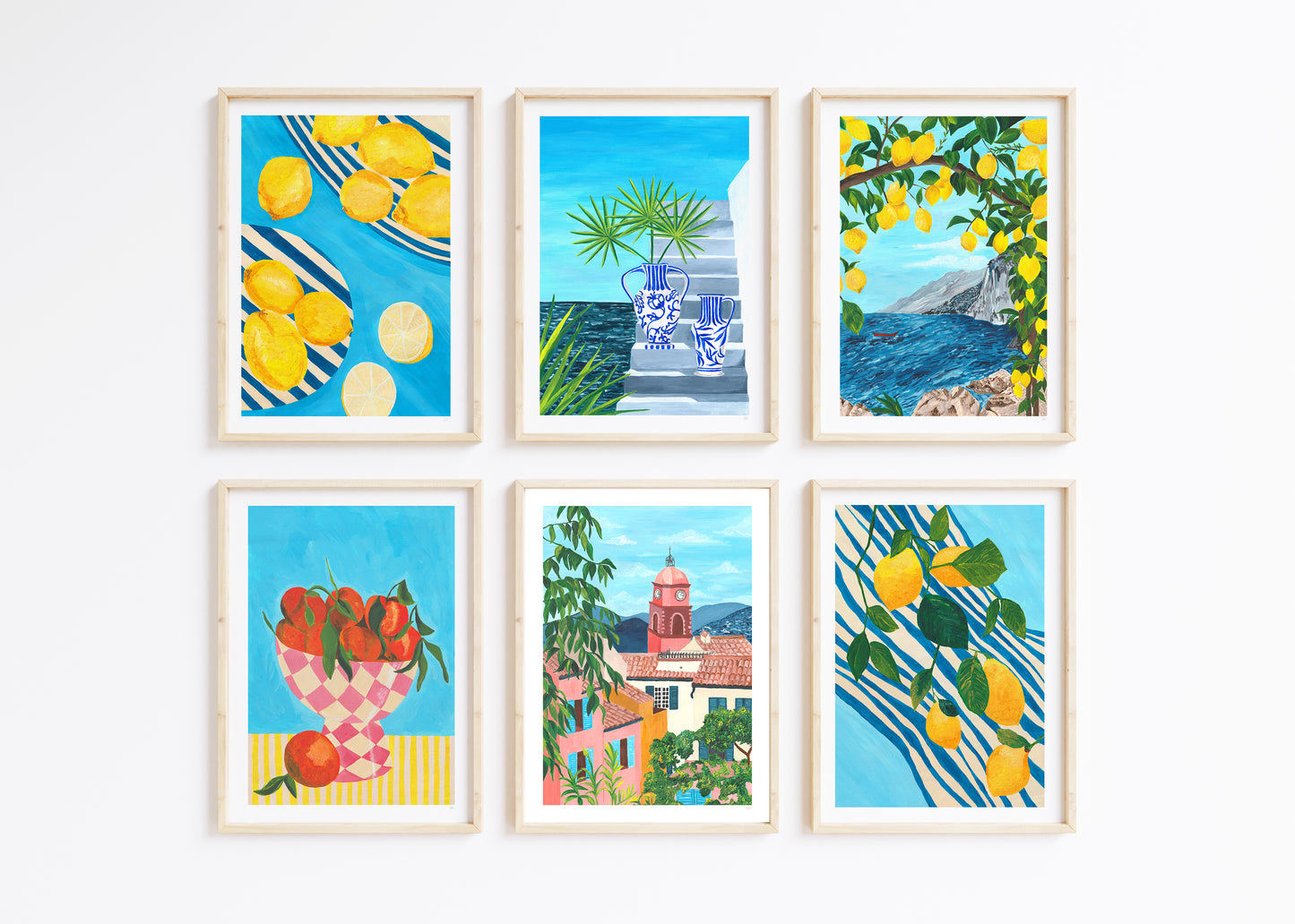 Set of six framed artworks with scenic and fruit-themed illustrations on a white background.