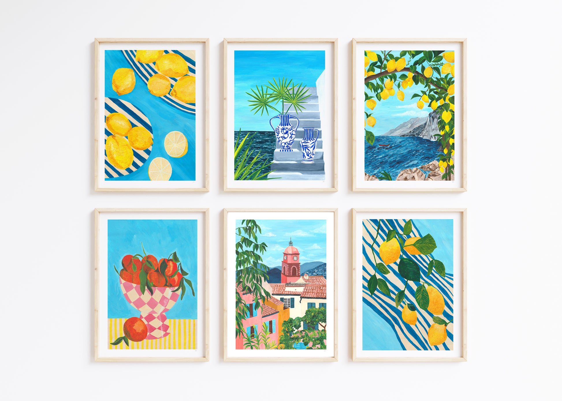 Set of six framed artworks with scenic and fruit-themed illustrations on a white background.