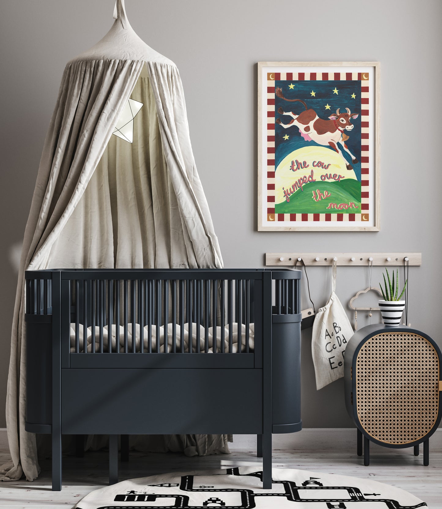 Nursery room with a black crib, decorative poster, and round mirror.