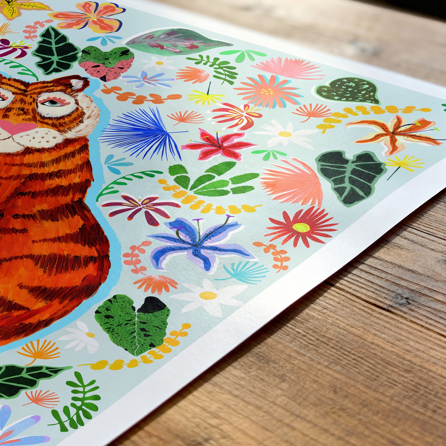 Colorful illustration of a tiger and floral patterns on a wooden surface