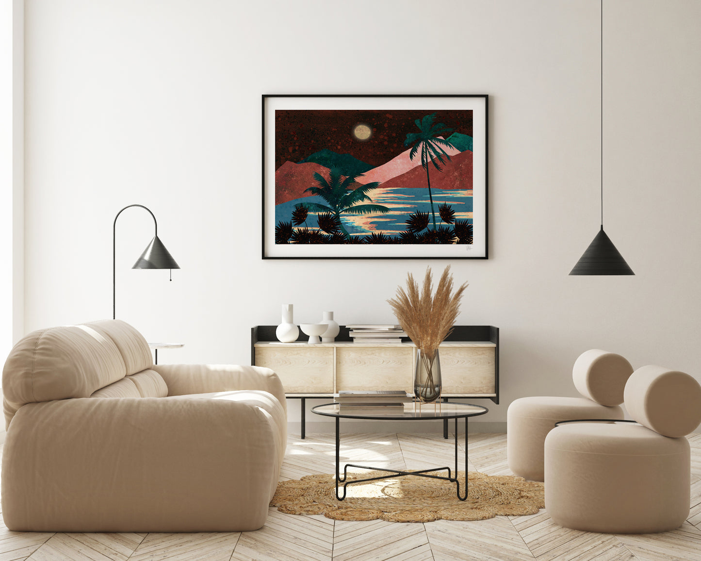 Modern living room with beige sofa, round ottoman, and framed artwork on the wall.