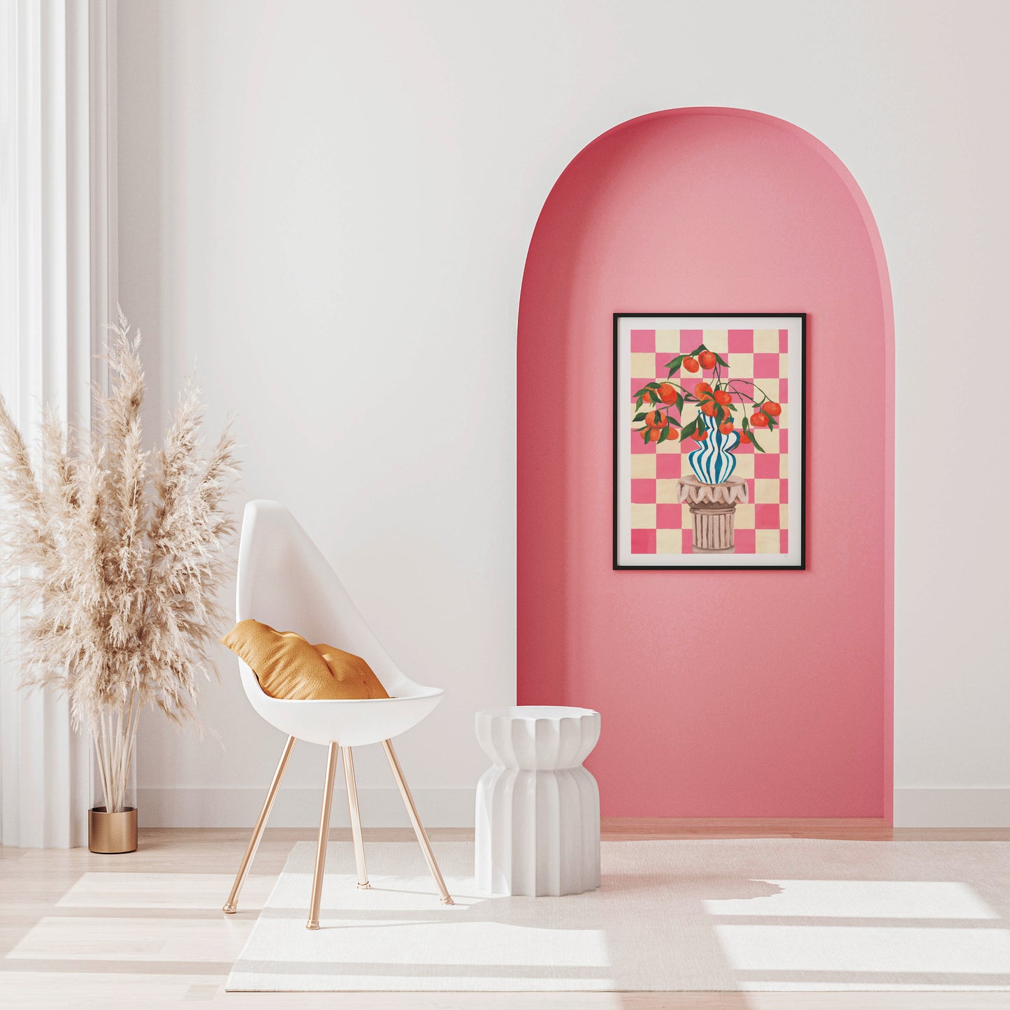 Modern interior with a white chair, pink wall, and citrus fruit artwork.