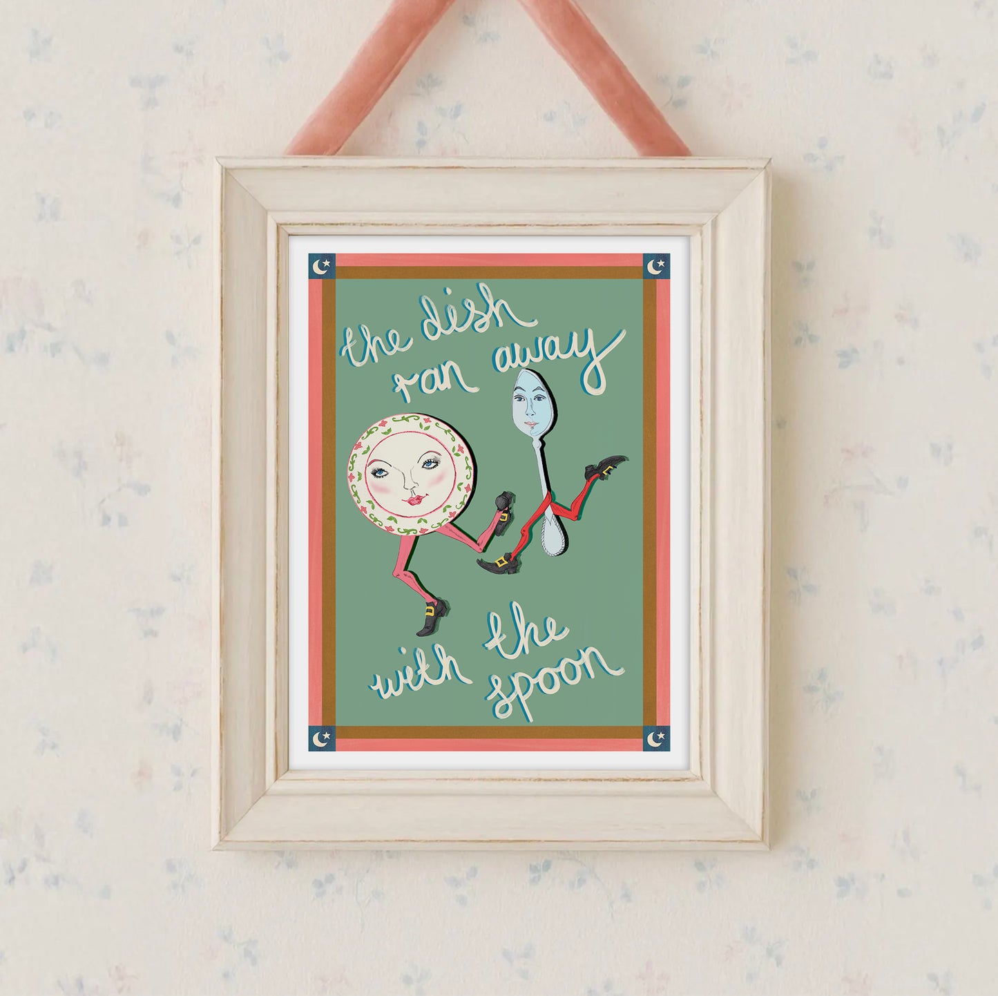 Framed artwork with a spoon and plate illustration and text on a light background