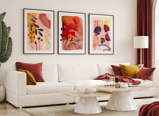 Modern living room with a white sofa, colorful pillows, and abstract art on the wall.
