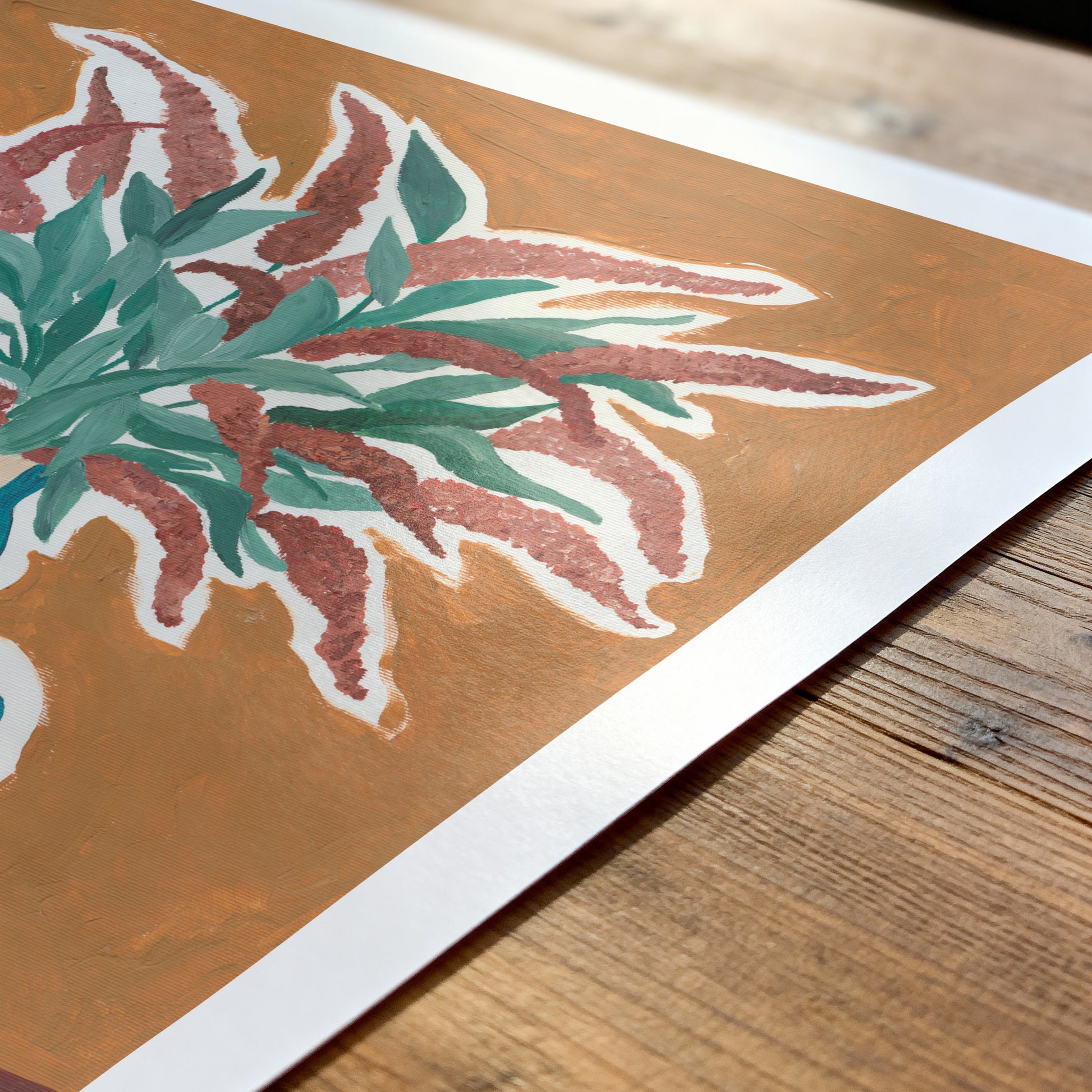 Artistic print of leaves on a wooden surface