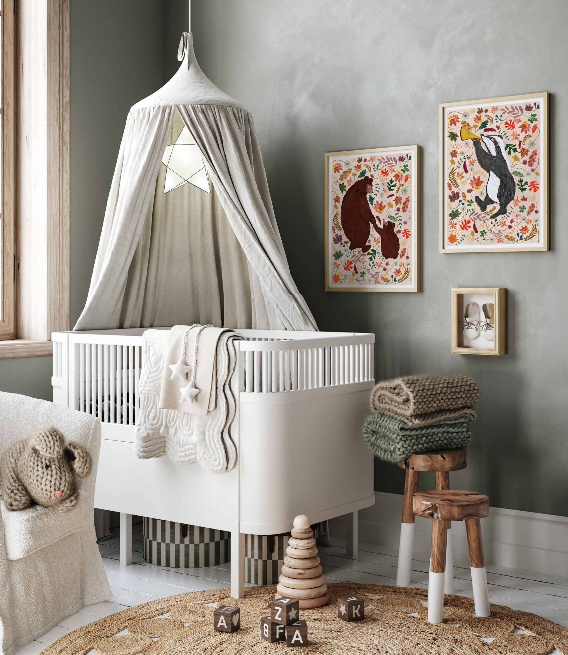 Nursery room with a white crib, decorative elements, and wall art.